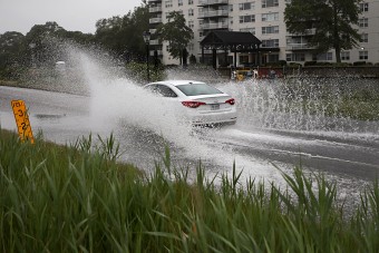 car driving through puddle