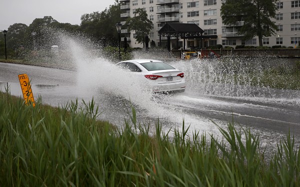 car driving through puddle
