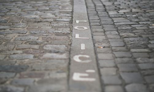 stone with word POLICE engraved on it
